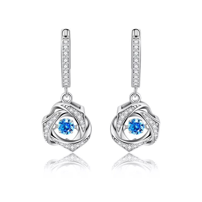 Topaz Simulant Motion Silver Earrings