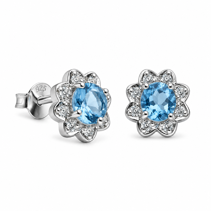 Created Blue Topaz and Cubic Zirconia Floral Stud Earrings in Rhodium-Plated Sterling Silver