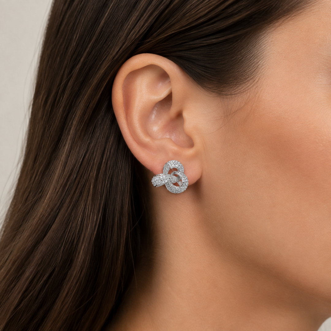 0.85 Inch Pavé Diamond Simulant Three-Loop Knot Stud Earrings in Rhodium-Plated Sterling Silver