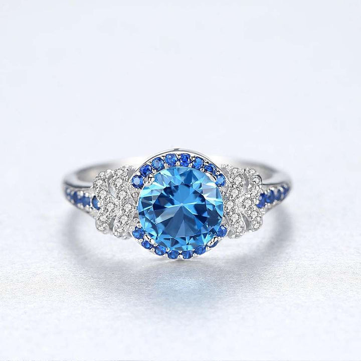 Topaz Simulant Halo Silver Ring